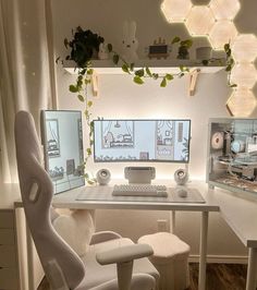 a desk with two computer monitors and a chair in front of it, all white