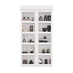 a white bookcase filled with lots of books and vases on top of it