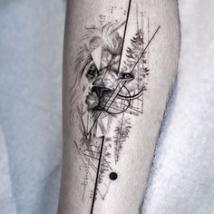 a black and white tattoo on the leg of a person with a wolf head in it