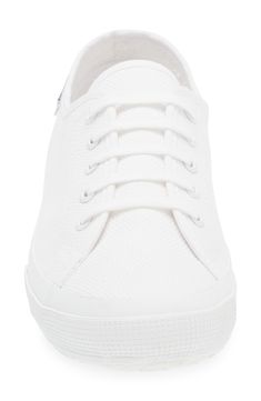 Bring tennis-inspired style to your wardrobe with this especially lightweight sneaker that boasts a cotton-canvas upper and a vulcanized-rubber sole. 1 3/4" heel; 1" platform Cushioned insole Textile upper and lining/rubber sole Imported Everyday White Canvas Sneakers, Sporty Cotton Sneakers With White Sole, High-top Cotton Canvas Shoes With Textured Sole, High-top Cotton Sneakers With Textured Sole, White Cotton Sneakers With Rubber Sole, Sporty Cotton Canvas Shoes With Textured Sole, Everyday White Textile Sneakers, White Cotton Canvas Shoes For Everyday, Everyday White Cotton Canvas Shoes