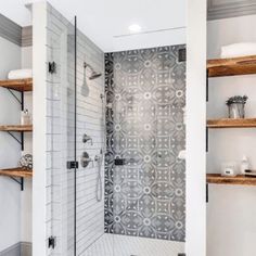 a bathroom with shelving and a walk in shower