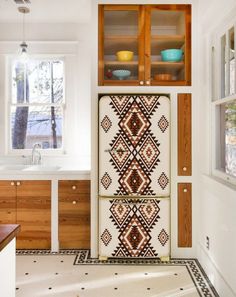 a kitchen with an old fashioned refrigerator in it