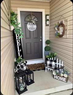 the front porch is decorated with black and white decorations