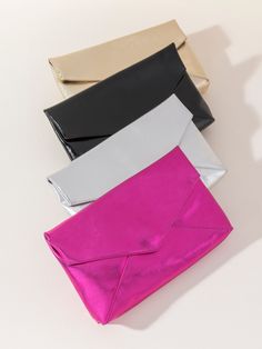 Shine bright and make a bold statement with Shiraleah’s Maddie Envelope Clutch. This chic and stylish oversized clutch is made from trendy metallic PU and adds a pop of glamorous black shimmer to any outfit. Shaped like an envelope with an elegant, triangular folding closure, this large handbag is perfect for fitting your phone, wallet, and other day or nighttime essentials. Pair with the matching Maddie Card Case, or other items from Shiraleah to complete your look! Shiraleah is a trend-driven Spa Wraps, Oversized Clutch, Large Handbag, Accessories Display, Large Handbags, Envelope Clutch, Framed Gifts, Zip Pouch, Frame Decor