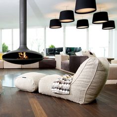 modern living room with wood flooring and large fireplace