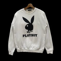 PLEASE ASK ANY QUESTION BEFORE BUYING  THIS IS USED CLOTHING PLEASE DON'T EXPECTED IT TO BE LIKE NEW OR IN PRISTINE  CONDITIONS!! Vintage Playboy Big Logo Spell Out Sweater Sweatshirt Tag playboy  Material polyester, cotton  Size on tag  Measures About (Approximately)  -Armpit to Ampit : 20 inch -Length (back collar down) : 26 inch -Shoulders : 18 inch -Sleeve Length : 25 inch Condition : used good condition  9/10 **No Tears, No Stains And No Holes** PLEASE READ THE DESCRIPTION AND POLICY BEFORE Retro White Sweatshirt For Winter, Retro White Winter Sweatshirt, White Retro Winter Sweatshirt, Retro White Sweater With Letter Print, White Retro Sweater With Letter Print, White Leisure Sweatshirt, White Hip Hop Sweatshirt With Ribbed Cuffs, White Cotton Sweatshirt For Leisure, White Cotton Leisure Sweatshirt