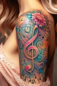 a woman's shoulder with music notes and a pink flower on the left arm