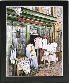 a watercolor painting of clothes on display in front of a clothing store with laundry hanging out to dry