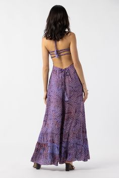 Be event-ready in the Tiare Hawaii Bellini Maxi Dress. This silhouette features a gorgeous caged back with delicate bands. The floor-length flowing design is made to captivate with one-of-a-kind beauty, dyed by hand. Details: 100% Rayon Hand wash cold & lay flat to dry Features: Unlined, Smocked bodice, Caged back, Self-tie halter straps for a customizable fit Bohemian Backless Maxi Dress With Smocked Back, Flowy Maxi Dress With Strappy Back, Flowy Backless Maxi Dress With Lace-up Back, Flowy Maxi Dress With Tie Back For Festivals, Flowy Strappy Back Maxi Dress With Tie Back, Bohemian Dress With Strappy Tie Back, Bohemian Dress With Tie Back And Strappy Design, Bohemian Dress With Tie And Strappy Back, Bohemian Maxi Dress With Strappy Back For Beach