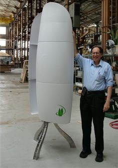 a man standing next to a large white object