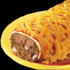 a yellow plate topped with noodles and meat