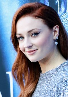 a close up of a person with red hair