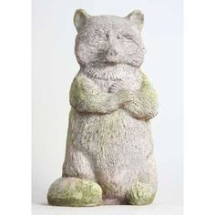 a statue of a cat with its arms crossed and eyes closed, sitting in front of a white background