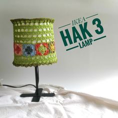 a lamp that is sitting on top of a white sheet with the words hak 3 lamp below it