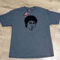 a t - shirt with the image of a young man's face on it