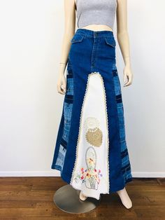 Vintage 1970s Patchwork Denim Maxi Skirt - high waisted - pockets with button closures - made from from french dip bell bottom jeans w/ patchwork waistbands - embroidered tablecloth with floral design, front & back - crochet trim - zipper fly Great vintage condition appx size - S 26 waist 36 hip 42.5 length / little longer at front All sales are final / as-is. We do not accept returns. Vintage Fitted Bottoms For Festival, Vintage Cotton Bottoms For Festival, Vintage Festival Bottoms With Pockets, Vintage Patchwork Bottoms, Retro Fitted Denim Skirt With Pockets, Vintage High-waist Bottoms For Festival, Vintage Fitted Skirt In Medium Wash, Vintage Fitted Medium Wash Skirt, Vintage Fitted Denim Skirt For Spring