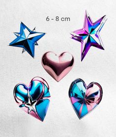 three heart shaped stars and one star with a bow on the side are shown in different colors