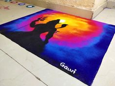 a colorful rug with the silhouette of a woman on it