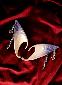 These stunning dragon elf ears feature handmade dangling purple and green earrings and hand painted dragon scales package includes 1 pair of elf ears Cosplay Elf Ears, Dragon Elf, Fae Cosplay, Larp Outfit, Fantasy Cottagecore, Cosplay Elf, Cottagecore Accessories, Painted Dragon, Elf Ear