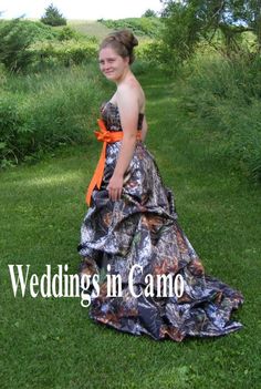 a woman is standing in the grass wearing a camo dress with an orange sash