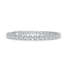 This classic tennis bracelet is a piece of striking beauty. The prong-set round lab-grown diamonds exude a breathtaking sparkle that's hard to miss. This bracelet secures with a catch clasp. Diamond White Tennis Bracelet With Prong Setting, Diamond White Brilliant Cut Tennis Bracelet, Fine Jewelry Tennis Bracelet With Brilliant Cut, Diamond White Tennis Bracelet With Round Cut Prong Setting, Lab Grown Diamond Bracelet With Prong Setting, Diamond Tennis Bracelet With Brilliant Round Cut, Diamond Tennis Bracelet With Brilliant Cut, Timeless Diamond Tennis Bracelet, Dazzling Tennis Bracelet With Prong Setting