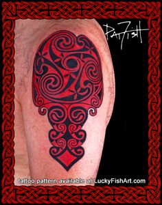 a red and black tattoo design on the leg of a man's arm with celtic designs