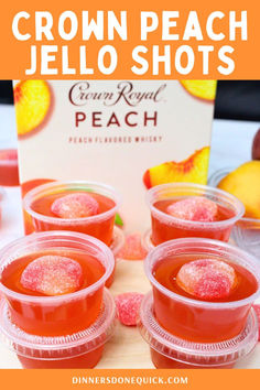 four small cups filled with peach jello shots