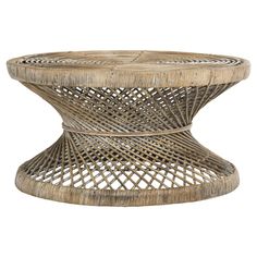 a wicker coffee table with an intricate design