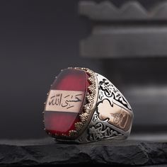 Arabic "God is Enough for me" Written Red Amber Gemstone Islamic Sterling Silver Ring for Men, Muslim Silver Ring, Arabic Calligraphy Ring A special 925 sterling silver ring is engraved with the Arabic inscription "Allah is Enough for Me" in a red fire amber stone. *General Description* -All Kuyumcuzade products are made of 925 sterling silver. -All Kuyumcuzade products are handcrafted. -The product ordered from Kuyumcuzade is specially prepared for the person who ordered it, according to the de Allah Is Enough For Me, God Is Enough, Desired Features, Silver Ring For Men, Amber Gemstone, Sterling Silver Mens Rings, Amber Stone, Mens Silver Rings, Ring For Men