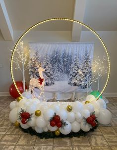 balloon arch with white and red balloons in front of a christmas scene on the wall