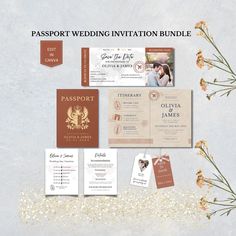 the passport wedding stationery bundle is displayed on a table with flowers and other items