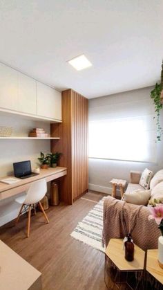 a living room filled with furniture and lots of plants on top of the shelves next to a window