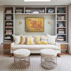 a living room filled with furniture and bookshelves next to a large glass window