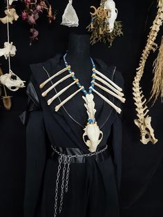 Have a Look at This Extra Large Raccoon Skull And Coyote Bone Necklace! There are 8 Real Coyote Radius Bones and 3 Real Coyote Vertebrae On This Necklace! The Raccoon Skull is in Near Perfect Condition. It is Strung on Blue leather and Beaded With Blue and Gold Beads. This Necklace is Adjustable From 26 - 30 Inches. All Items Ship Within 1-3 Days via USPS Ground Advantage Service. Shipping on these will be 5.50 (USA Only) All additional items are FREE! I Am Only Offering International Shipping To Canada Right Now, I Apologize as Customs Overseas is Growing Evermore Difficult With Bones and Skulls. Canada 25.00 + 2.00 For Each Additional Item. I DO NOT Carry Human Bones or Any Sort of Illegal Items. And As Etsy Sellers, We Are Not Allowed to Sell Domesticated Dog or Cat Bones of Any Sort. A Cat Bones, Radius Bone, Real Bone Jewelry, Raccoon Skull, Wiccan Necklace, Antler Necklace, Human Bones, Real Bones, Halloween Necklace