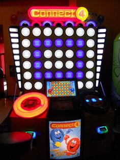 the electronic game connect 4 is lit up and ready to play