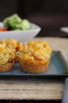 two mini cheese muffins on a blue plate