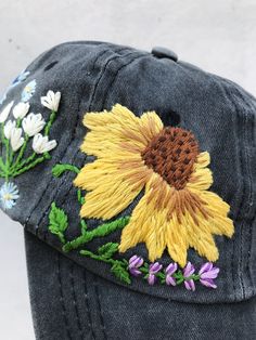 Hand Embroidered Hat is the best gift for her! 🌿 PLEASE NOTE THIS HAT IS READY TO SHIP🌿 Color: a black baseball cap. Design: hand embroidered echinacea with wildflowers. Cap size (head circumference): 55 - 62 cm. GET 10% OFF YOUR 1ST ORDER! Get a 10% off coupon code for our Etsy shop by signing up to our mailing list eepurl.com/gefZy5 CHECK OUR OTHER ACCESSORIES 🌸More Baseball hats: https://www.etsy.com/shop/KazkovaEmbroidery?ref=seller-platform-mcnav&section_id=25392998 🌿Kids Baseball h Embroidered Cotton Hat As Gift, Embroidered Snapback Hat As Gift, Embroidered Snapback Hat As A Gift, Spring Embroidered Hat For Gift, Embroidered Black Hats As Gifts, Embroidered Cotton Baseball Cap As Gift, Embroidered Multicolor Cap, Multicolor Embroidered Cap, Embroidered Flower Shaped Hat