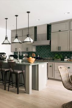 a kitchen filled with lots of counter top space next to a dining room table and chairs