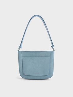 This item is part of our Online Exclusive selection, which consists of unique colourways and designs that are only available for purchase at CHARLESKEITH.COM.This product is made with at least 20% sustainable materials by weight. CHARLES & KEITH uses recycled, degradable, organic, and water-based materials in our eco-conscious collection.A denim bag just completes any outfit with an effortlessly cool vibe. This iteration features an angular, boxy shape that is both sturdy and structured, alongsi Trendy Blue Recycled Denim Shoulder Bag, Blue Recycled Denim Bags, Modern Denim Blue Shoulder Bag For Everyday, Trendy Recycled Denim Bags For Daily Use, Casual On-the-go Shoulder Bag With Flat Pocket, Blue Recycled Denim Shoulder Bag For Daily Use, Modern Denim Blue Bag For Everyday Use, Trendy Recycled Denim Shoulder Bag For Daily Use, Blue Recyclable Shoulder Bag For Daily Use