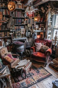 a living room filled with lots of books and furniture