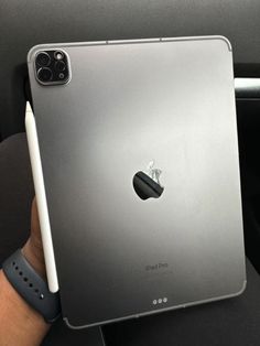 an apple ipad is held up in the car