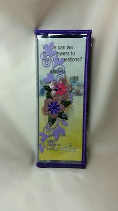 a purple case with flowers on it is sitting on a white sheet and has the words, can we make these questions?