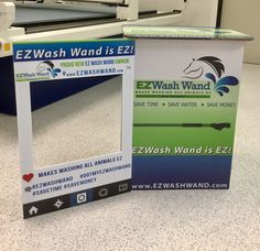 an ez wash box sitting on the floor in front of a table top machine