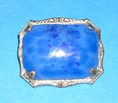 WELCOME TO MY SHOP *PLEASE READ SHIPPING ANNOUNCEMENT before purchasing*. I have this lovely little Art Deco Czech blue sterling pin. Very petite and ornate. Purchased from a recent estate sale in perfect vintage condition. I do my best to list any imperfections, but I am only human and sometimes I do miss something. Please feel free to message with any questions and I will do my best to answer them. However, please remember there are time differences, if you message me at 3 a.m. I am probably not going to answer til the following day. Don't panic, I will get to you as quickly as I can.  If purchasing from outside the US PLEASE do not ask me to change the customs forms! If there is a problem with your order, PLEASE contact me. I can't fix it if I don't know about it until after you leave y Blue Cabochon Brooch For Formal Occasions, Formal Blue Cabochon Brooch, Antique Blue Collectible Brooches, Blue Cabochon Brooches For Wedding, Art Deco Blue Brooches As Gifts, Art Deco Blue Brooches For Gifts, Blue Art Deco Formal Brooch, Ornate Blue Brooch For Formal Occasions, Making Mistakes