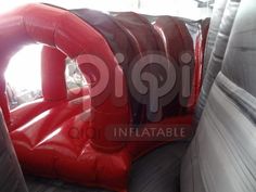 an inflatable blow up tent with red and black seats