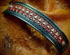 "This leather cuff bracelet in Black and red hand dyed leather uses natural american veg-tan leather that is lined in smooth calfskin. It is Hand tooled in a unique textured diamond pattern and border stamped. Edges are burnished and the top is studded with distressed nickel spots. It is 2\" at it's widest and tapers down to 1-5/8\". A truly regal cuff that will turn heads! I'll need your wrist size for this cuff! Please use the instructions in the pics above! - Hand tooled diamond pattern - 2\" Western Style Hand Tooled Leather Bracelets, Handmade Red Leather Bracelet, Handmade Custom Leather Bracelet, Western Hand Tooled Leather Bracelet, Custom Handmade Leather Bracelets, Adjustable Red Leather Bracelet, Western Leather Bracelets, Western Leather Cuff Bracelet As Gift, Leather Cuff Bracelet With Patina Artisan Style