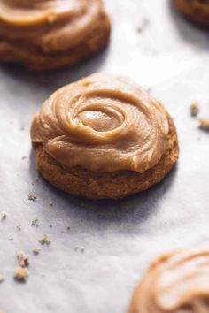 cookies with peanut butter frosting on a baking sheet