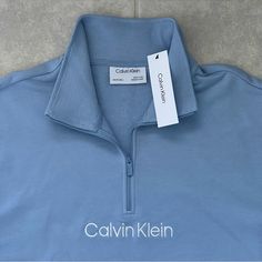 Calvin Klein Men Relaxed Fit French Terry Quarter-Zip Logo Sweatshirt Color: Light Blue Size: Xxl Brand New Retail Price $98.00 A Quarter-Zip Closure Freshens This Classic Layering Look From Calvin Klein, A Soft Relaxed Fit Sweatshirt In French Terry With Signature Flair. Material: 88% Cotton 12% Polyester Imported Zipper Closure Machine Washable Relaxed Fit Long Sleeve Sweatshirt Stand Collar And Quarter Zip French Terry Fabric Ribbed Knit Trim Embroidered Calvin Klein Logo At Chest And On Side Calvin Klein Blue Cotton Tops, Blue Calvin Klein Cotton Tops, Blue Cotton Half-zip Sweatshirt, Calvin Klein Sporty Long Sleeve Tops, Calvin Klein Hoodie, Brown Sweatshirt, Black Crewneck Sweatshirt, Henley Shirt Men, French Terry Hoodie