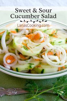 a bowl filled with cucumber salad on top of a table