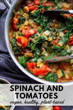 spinach and tomato soup in a pot with spoons